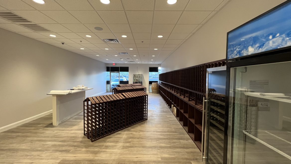 Interior of a Wine Shop & Bar with black cabinets